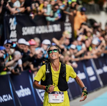 TOPSHOT-ULTRA-TRAIL-FRA-UTMB topshot us trailer courtney dauwalter celebrates as she crosses the finish line to win the 20th edition of the ultra trail du mont blanc (utmb), a 173km trail race crossing france, italy and switzerland in chamonix, south eastern france on september 2, 2023. (photo by jeff pachoud / afp) (photo by jeff pachoud/afp via getty images)