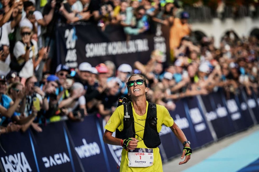 topshot us trailer courtney dauwalter celebrates as she crosses the finish line to win the 20th edition of the ultra trail du mont blanc utmb, a 173km trail race crossing france, italy and switzerland in chamonix, south eastern france on september 2, 2023 photo by jeff pachoud afp photo by jeff pachoudafp via getty images