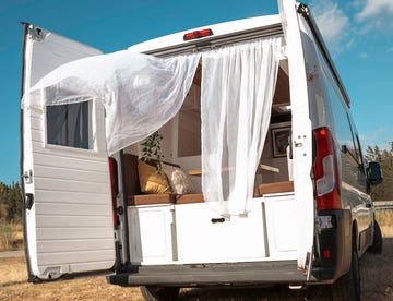 interior of a nordic style handcrafted campervan at sunset transportation, travel, tourism, vacation, lifestyle