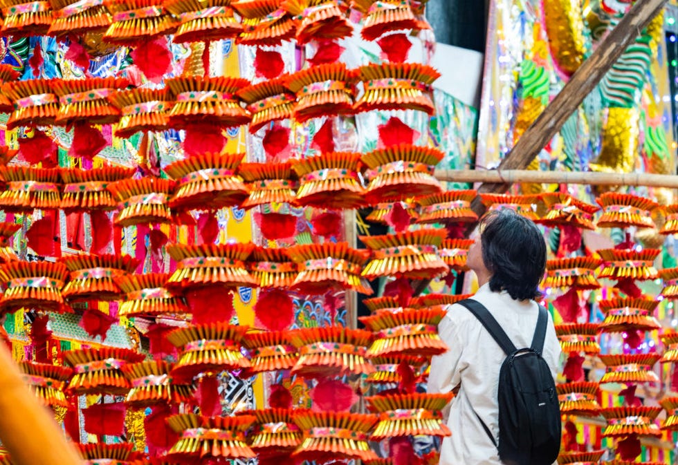hong kong, china august 30 a citizen looks at paper offerings at king george v memorial park during yulan festival, also known as the hungry ghost festival, on august 30, 2023 in hong kong, china photo by hou yuchina news servicevcg via getty images