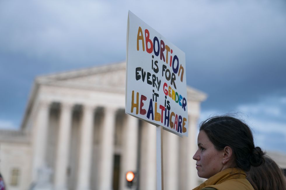 abortion rights advocates demonstrate in front of the us supreme court building on may 4, 2022 in washington, dc