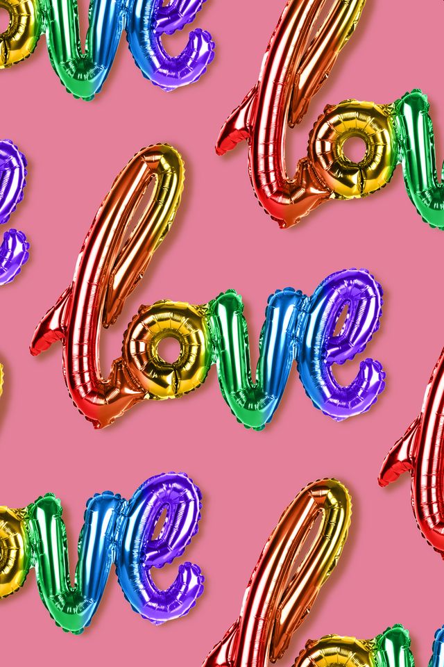 inscription love, rainbow balloons on pink background
