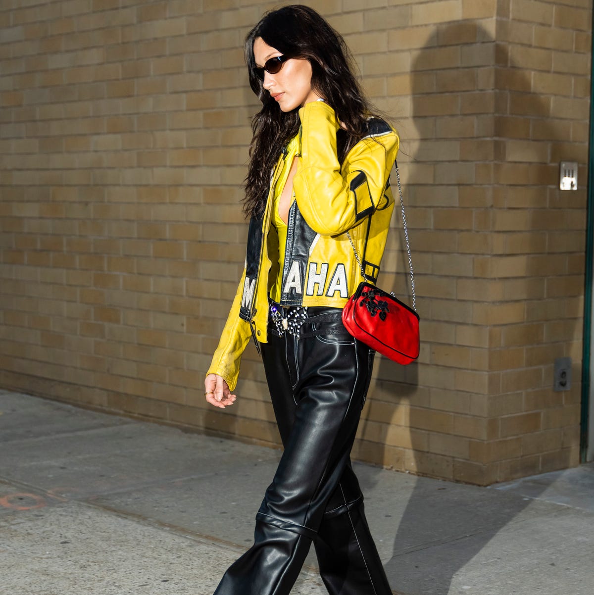 Bella Hadid Swaps Her Baby Tee for a Yellow Leather Racing Jacket