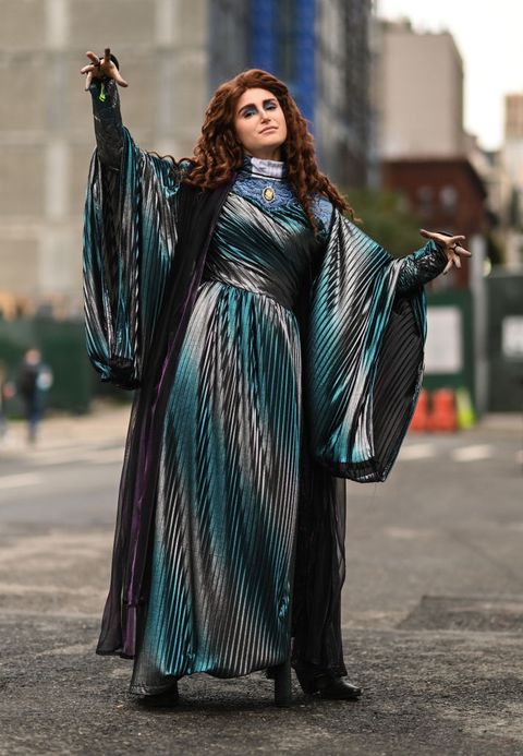 a cosplayer poses as agatha harkness from wandavision outside new york comic con in new york city