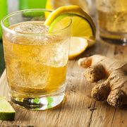 organic ginger ale soda in a glass with lemon and lime benefits of ginger