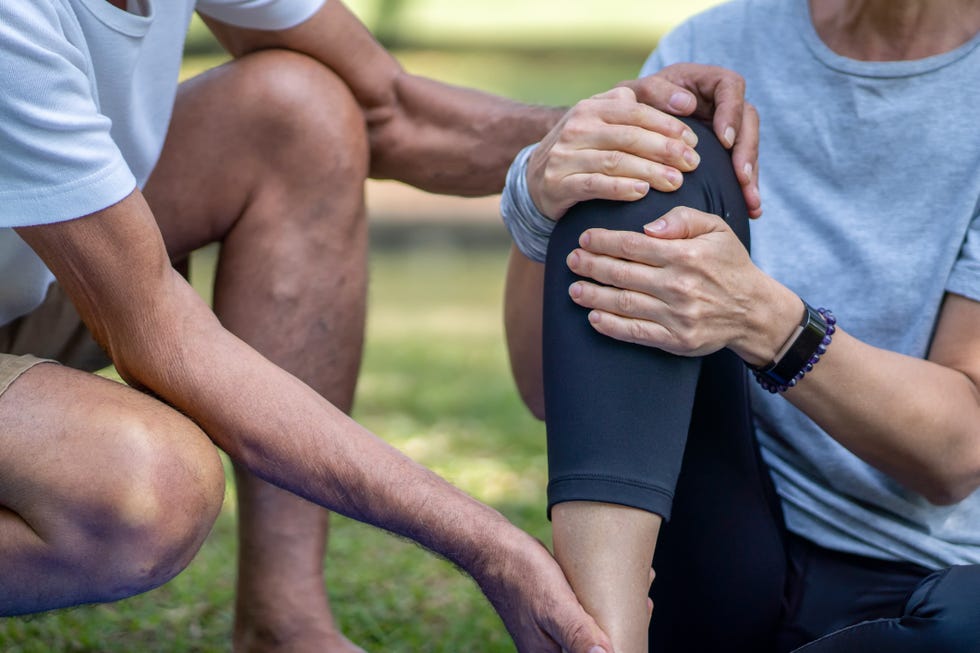 senior woman suffering from an ankle injury while exercising