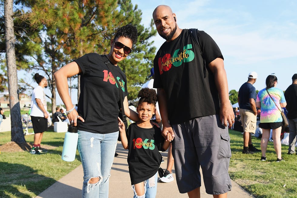 tulsa, ok june 19 a family poses for a picture during the juneteenth festival on june 19, 2021 in tulsa, oklahoma juneteenth celebrations, now recognized as a federal holiday, are taking place around the country in recognition of the emancipation of enslaved african american people photo by michael b thomasgetty images
