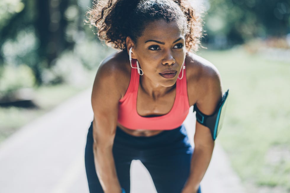 young african american woman resting after work out outdoors