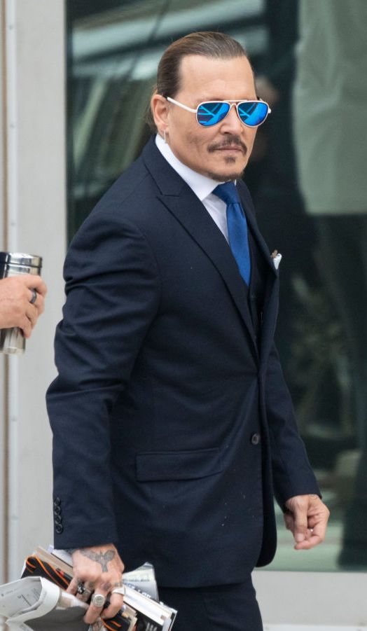 fairfax, va   april 25 ny  nj newspapers out johnny depp arrives outside court during the johnny depp and amber heard civil trial at fairfax county circuit court on april 25, 2022 in fairfax, virginia depp is seeking $50 million in alleged damages to his career over an op ed heard wrote in the washington post in 2018photo by chris kleponisconsolidated news picturesgetty images