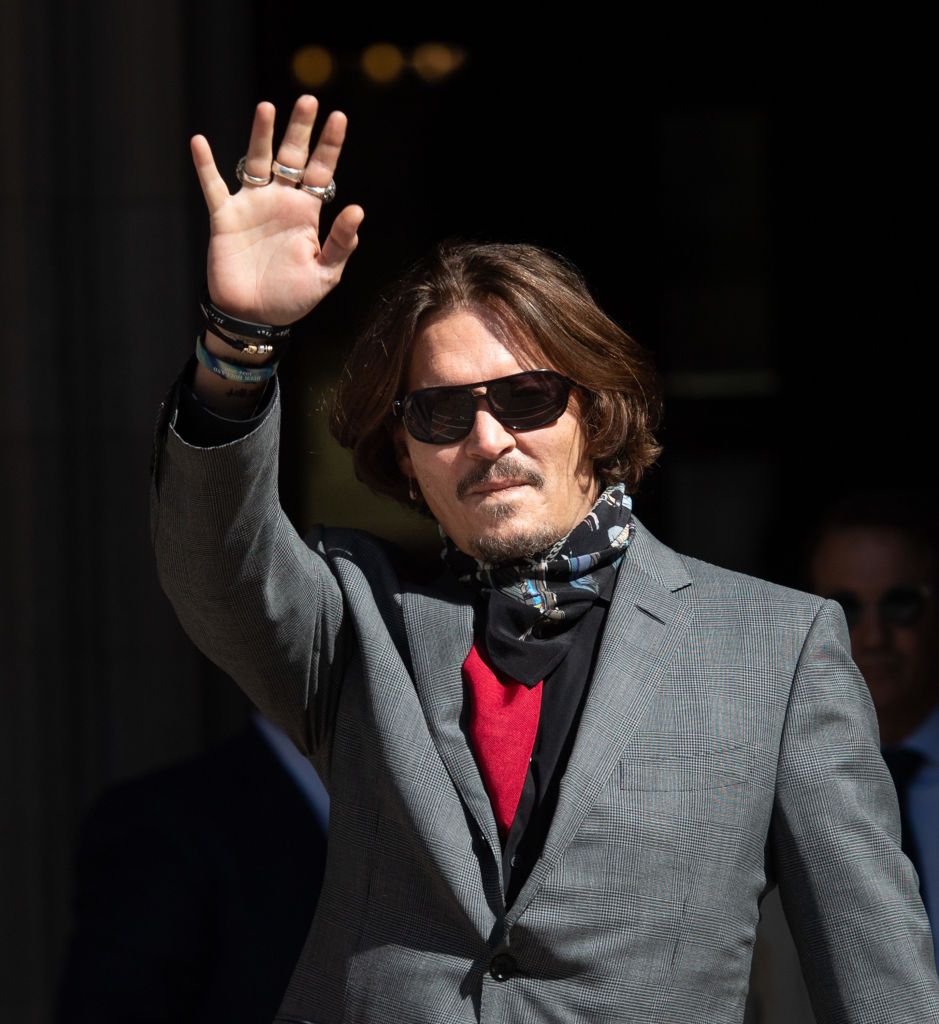 london, england   july 21 johnny depp arrives at the royal courts of justice, strand on july 21, 2020 in london, england the hollywood actor is suing news group newspapers ngn and the suns executive editor, dan wootton, over an article published in 2018 that referred to him as a wife beater during his marriage to actor amber heard photo by samir husseinwireimage