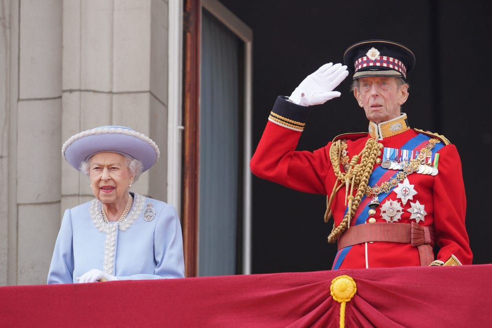 topshot   britains queen elizabeth ii stands with britains prince edward, duke of kent, on the balcony of buckingham palace as the troops march past during the queens birthday parade, the trooping the colour, as part of queen elizabeth iis platinum jubilee celebrations, in london on june 2, 2022   huge crowds converged on central london in bright sunshine on thursday for the start of four days of public events to mark queen elizabeth iis historic platinum jubilee, in what could be the last major public event of her long reign photo by jonathan brady  pool  afp photo by jonathan bradypoolafp via getty images