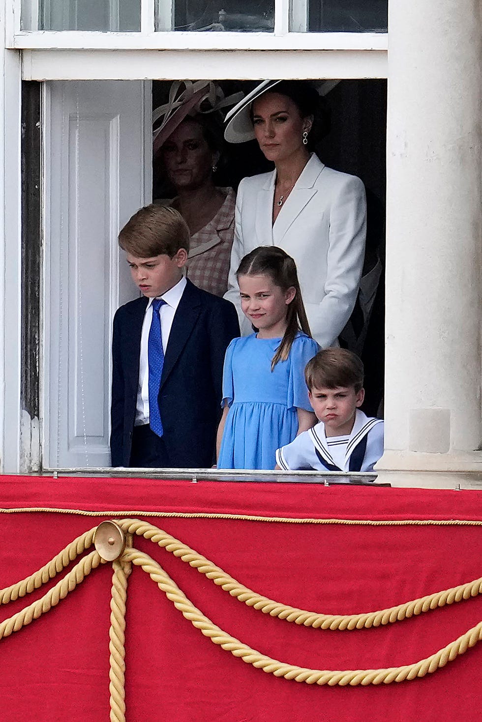 britains catherine, duchess of cambridge stands with her children britains prince george of cambridge, britains princess charlotte of cambridge and britains prince louis of cambridge on the balcony of buckingham palace bas the troops march past during the queens birthday parade, the trooping the colour, as part of queen elizabeth iis platinum jubilee celebrations, in london on june 2, 2022   huge crowds converged on central london in bright sunshine on thursday for the start of four days of public events to mark queen elizabeth iis historic platinum jubilee, in what could be the last major public event of her long reign photo by matt dunham  pool  afp photo by matt dunhampoolafp via getty images