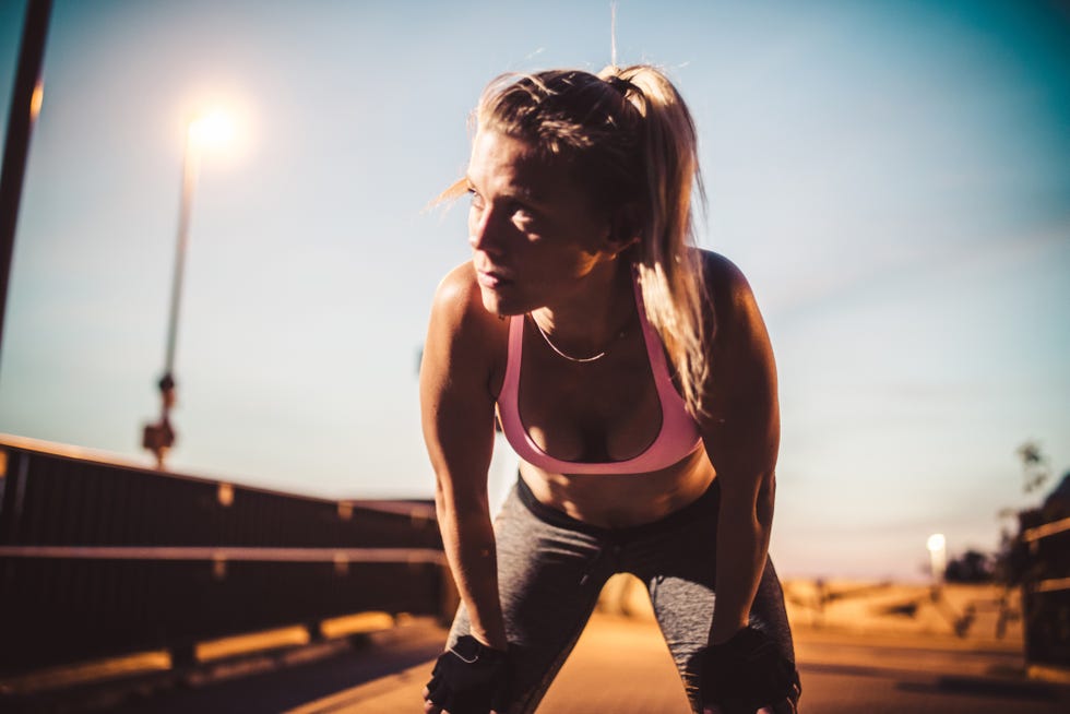 exhausted woman after fitness workout, doing freeletics outdoor in the city