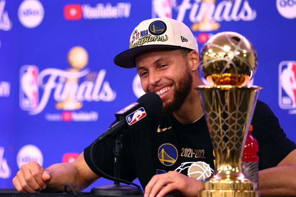 boston, massachusetts   june 16 stephen curry 30 of the golden state warriors raises the bill russell nba finals most valuable player award after defeating the boston celtics 103 90 in game six of the 2022 nba finals at td garden on june 16, 2022 in boston, massachusetts note to user user expressly acknowledges and agrees that, by downloading andor using this photograph, user is consenting to the terms and conditions of the getty images license agreement photo by elsagetty images