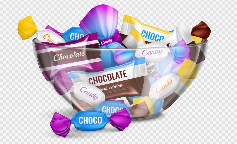 assorted chocolate candies in foil wrappings in glass bowl realistic advertising composition against transparent background vector illustration