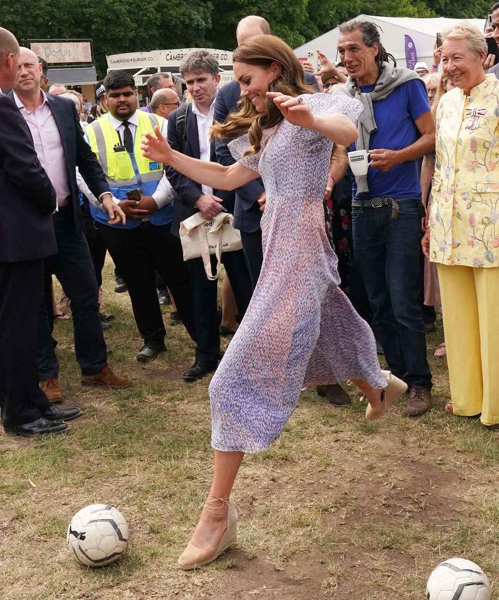 cambridge, england   june 23 catherine, duchess of cambridge takes a kick of a ball as she attends cambridgeshire county day at newmarket racecourse during an official visit to cambridgeshire on june 23, 2022 in cambridge, england photo by paul edwards   wpa poolgetty images