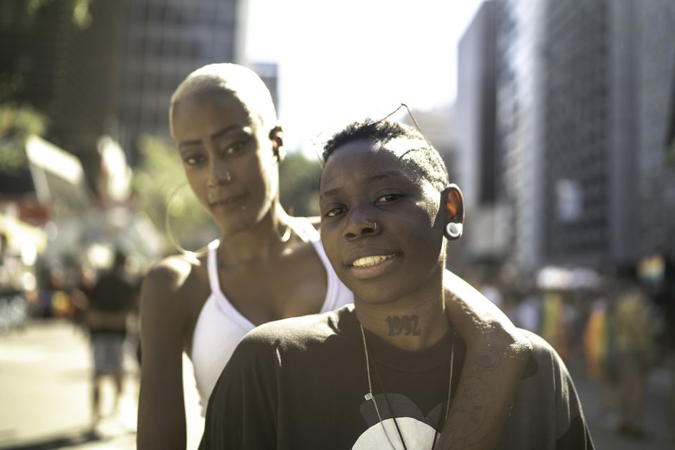 portrait of lesbian couple looking at camera in the city
