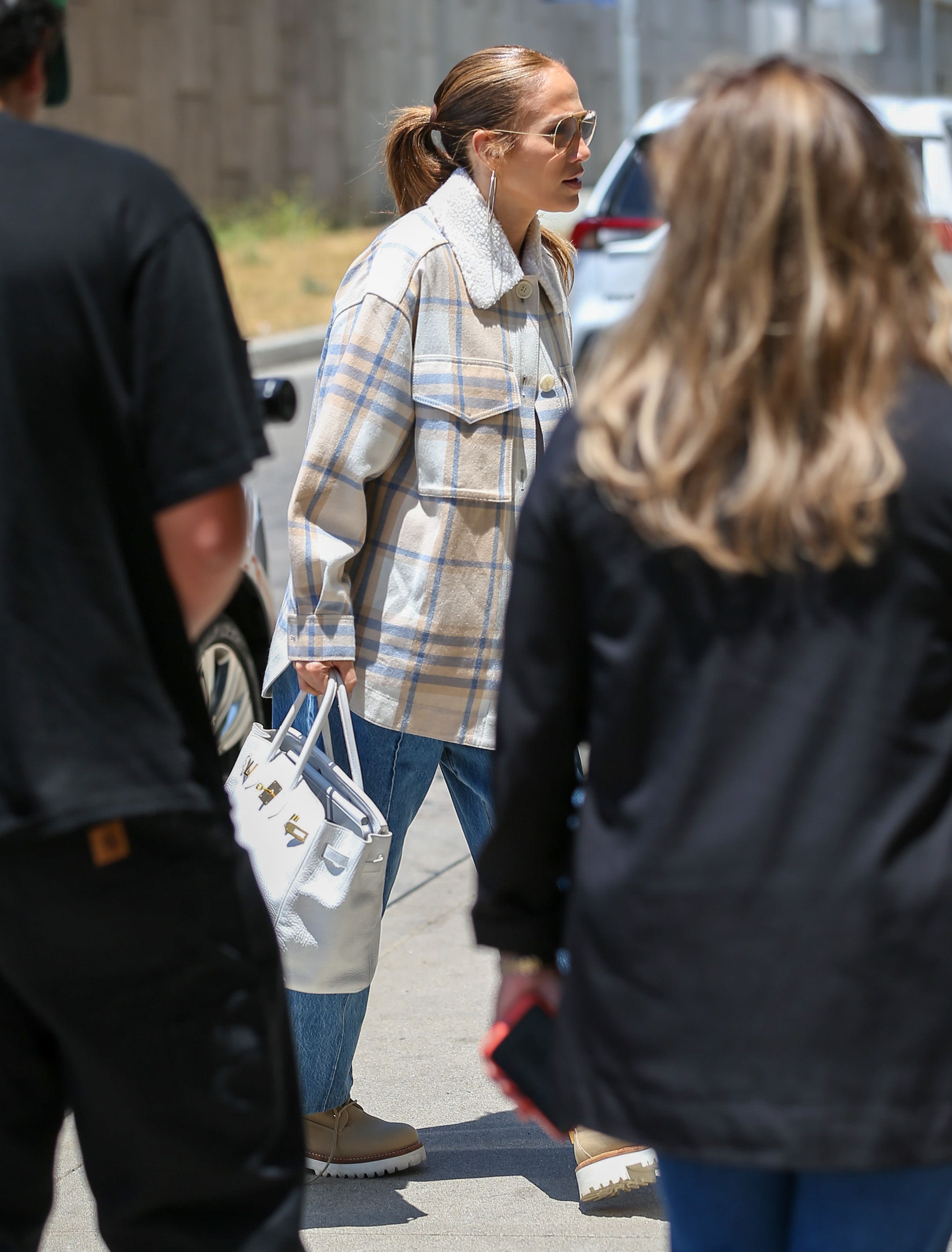 Jennifer Lopez Looks Cool in a Breezy Button-Down and Distressed Jeans