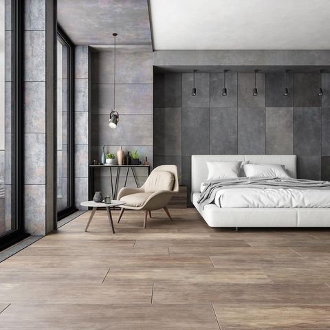 large format stone tiles lend a contemporary feel in a bedroom