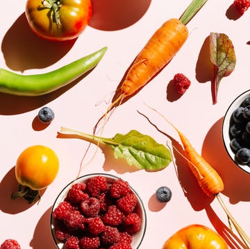 Pattern of variety fresh of organic berry fruits and vegetables and healthy vegan meal ingredients on pink background. Healthy food, clean eating, diet and detox, eco friendly, no plastic concept. Flat lay, top view pattern of variety fresh of organic berry fruits and vegetables and healthy vegan meal ingredients on pink background. concept of food, vegetable, agriculture, harvest, food producer and healthy and vegetarian food.. flat lay, top view