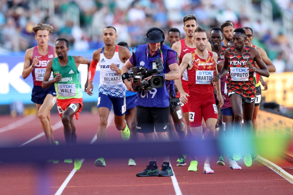 eugene, oregon   july 18 athletes in the mens 3000m steeplechase final run around a cameraman on the track on day four of the world athletics championships oregon22 at hayward field on july 18, 2022 in eugene, oregon photo by patrick smithgetty images