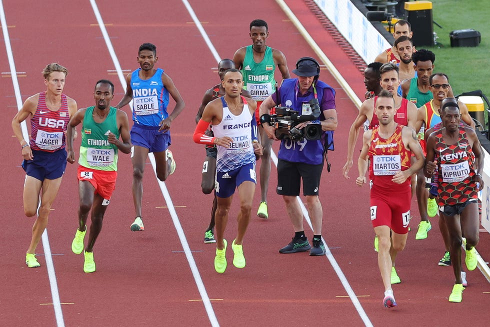 eugene, oregon   july 18 athletes in the mens 3000m steeplechase final run around a cameraman on the track on day four of the world athletics championships oregon22 at hayward field on july 18, 2022 in eugene, oregon photo by carmen mandatogetty images