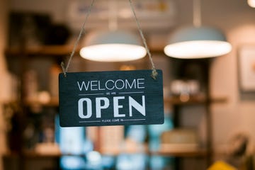 open sign on cafe hang on door at entrance