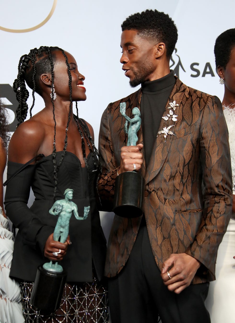 los angeles, ca   january 27 lupita nyongo and chadwick boseman, winners of outstanding performance by a cast in a motion picture for black panther, pose in the press room during the 25th annual screen actors guild awards at the shrine auditorium on january 27, 2019 in los angeles, california photo by dan macmedangetty images
