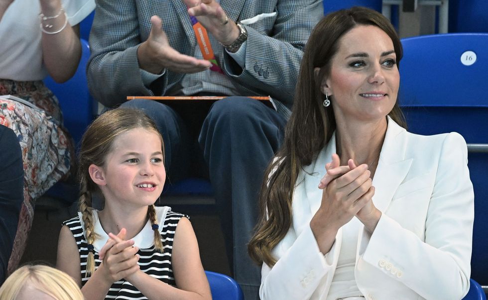britains princess charlotte of cambridge l reacts as she sits with her mother britains catherine, duchess of cambridge to watch the mens 1500m freestyle heats swimming event at the sandwell aquatics centre, on day five of the commonwealth games in birmingham, central england, on august 2, 2022 photo by oli scarff  afp photo by oli scarffafp via getty images