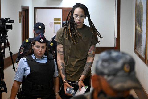 us basketball player brittney griner c is escorted by police before a hearing during her trial on charges of drug smuggling, in khimki, outside moscow on august 2, 2022   griner was detained at moscows sheremetyevo airport in february 2022 just days before moscow launched its offensive in ukraine she was charged with drug smuggling for possessing vape cartridges with cannabis oil speaking at the trial on july 27, griner said she still did not know how the cartridges ended up in her bag photo by natalia kolesnikova  afp photo by natalia kolesnikovaafp via getty images
