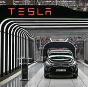 an electric vehicle of the model y is pictured during the start of the production at teslas gigafactory on march 22, 2022 in gruenheide, southeast of berlin   us electric car pioneer tesla received the go ahead for its gigafactory in germany on march 4, 2022, paving the way for production to begin shortly after an approval process dogged by delays and setbacks photo by patrick pleul  pool  afp photo by patrick pleulpoolafp via getty images