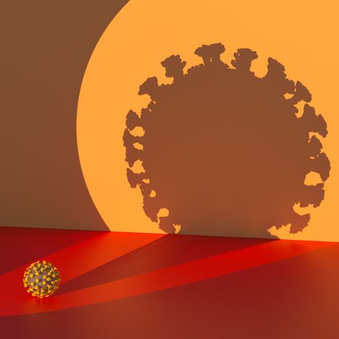 digital generated image of highlighted by circular spot light coronavirus covid 19 and projected huhe shadowsilhouette to wall