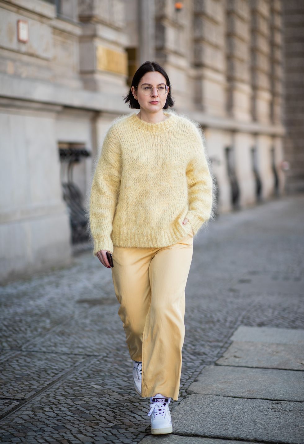 berlin, germany   january 02 maria barteczko is seen wearing yellow mohair sweater hm, yellow wide leg pants hm, white high top sneaker nike air force, gold round retro glasses ray ban on january 02, 2019 in berlin, germany photo by christian vieriggetty images