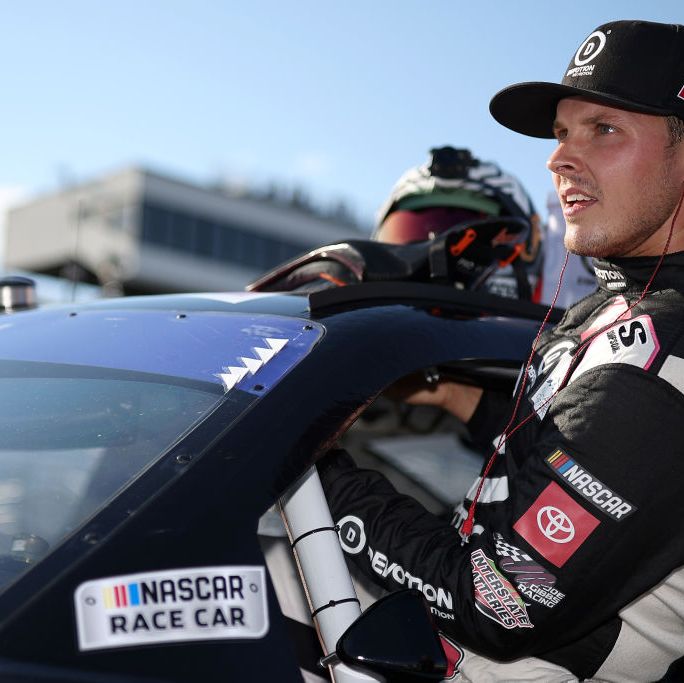 loudon, new hampshire   july 15 trevor bayne, driver of the 18 devotion nutrition toyota, enters his car during qualifying for the nascar xfinity series crayon 200 at new hampshire motor speedway on july 15, 2022 in loudon, new hampshire photo by james gilbertgetty images