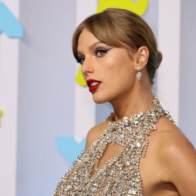 Taylor Swift Makes Surprise VMAs Appearance in Bejeweled Silver Minidress