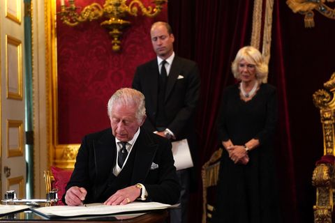 london, england   september 10 king charles iii signs an oath to uphold the security of the church in scotland during his proclamation as king during the accession council on september 10, 2022 in london, united kingdom his majesty the king is proclaimed at the accession council in the state apartments of st jamess palace, london the accession council, attended by privy councillors, is divided into two parts in part i, the privy council, without the king present, proclaims the sovereign and part ii where the king holds the first meeting of his majestys privy council the accession council is followed by the first public reading of the principal proclamation read from the balcony overlooking friary court at st jamess palace the proclamation is read by the garter king of arms, accompanied by the earl marshal, other officers of arms and the serjeants at arms photo by victoria jones   wpa poolgetty images
