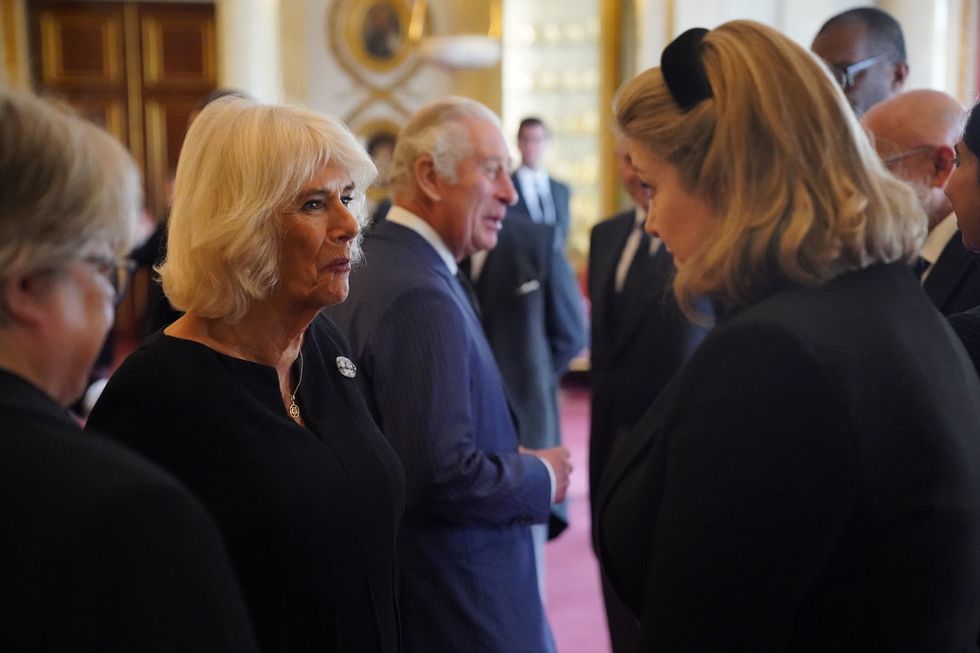 london, england   september 10 camilla, queen consort 2nd l speaks to britains leader of the house of commons penny mordaunt during king charles iiis audience with prime minister liz truss not pictured and members of her cabinet in the 1844 room, at buckingham palace on september 10, 2022 in london, england king charles iii was proclaimed today and later met with his government and opposition ministers at buckingham palace photo by jonathan brady   wpa poolgetty images