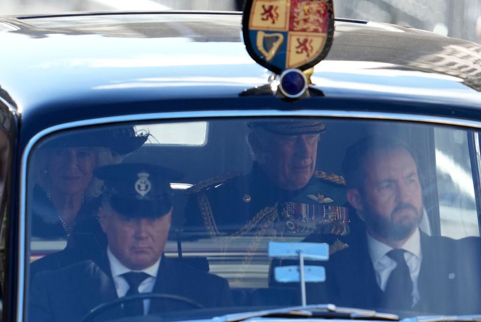 edinburgh, scotland   september 12 king charles iii and camilla, the queen consort, drive along the royal mile after leaving st giles cathedral on september 12, 2022 in edinburgh, scotland at the cathedral there was a service to celebrate the life of queen elizabeth ii and her connection to scotland photo jon super   wpa poolgetty images