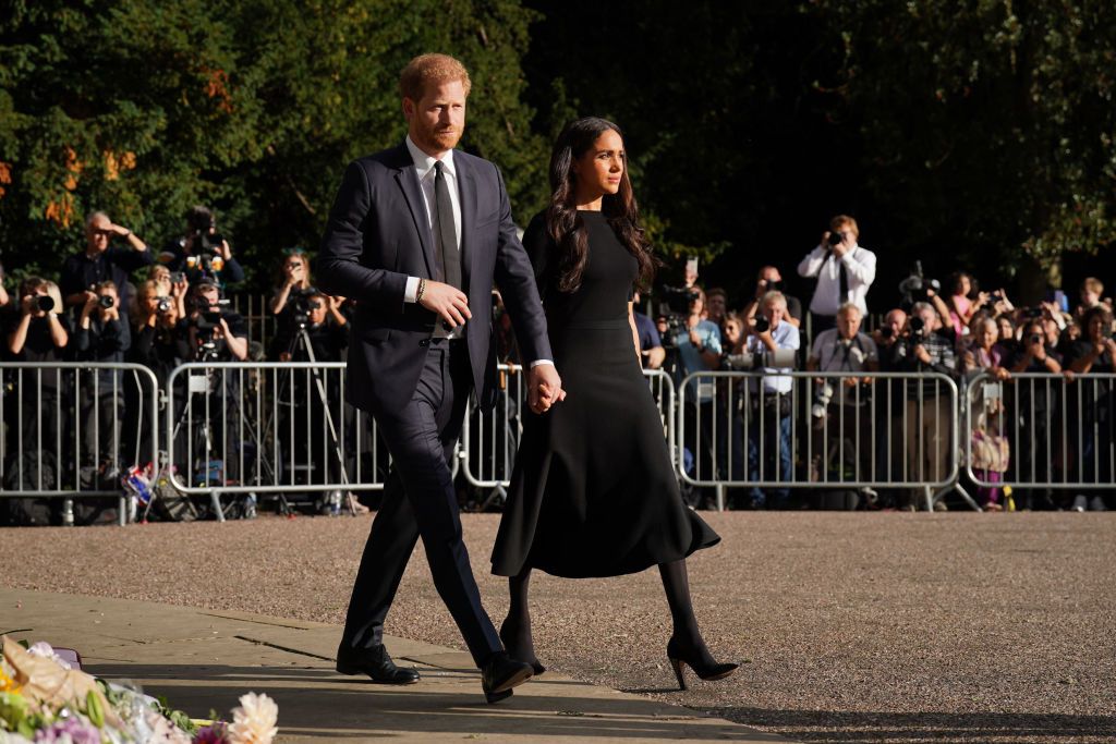 windsor, england   september 10 prince harry, duke of sussex, and meghan, duchess of sussex view floral tributes left at windsor castle on september 10, 2022 in windsor, england crowds have gathered and tributes left at the gates of windsor castle to queen elizabeth ii, who died at balmoral castle on 8 september, 2022 photo by kirsty oconnor   wpa poolgetty images