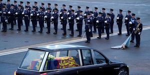 topshot   the queens colour squadron, raf, stand by as the coffin of queen elizabeth ii is taken away in the royal hearse from the royal air force northolt airbase on september 13, 2022, to travel to buckingham palace   mourners in edinburgh filed past the coffin of queen elizabeth ii through the night, before the monarchs coffin returns to london to lie in state ahead of her funeral on september 19 photo by andrew matthews  pool  afp photo by andrew matthewspoolafp via getty images