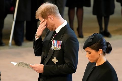 london, england   september 14 an emotional prince harry, duke of sussex and meghan, duchess of sussex pay their respects in the palace of westminster after the procession for the lying in state of queen elizabeth ii on september 14, 2022 in london, england queen elizabeth iis coffin is taken in procession on a gun carriage of the kings troop royal horse artillery from buckingham palace to westminster hall where she will lay in state until the early morning of her funeral queen elizabeth ii died at balmoral castle in scotland on september 8, 2022, and is succeeded by her eldest son, king charles iii  photo by christopher furlonggetty images