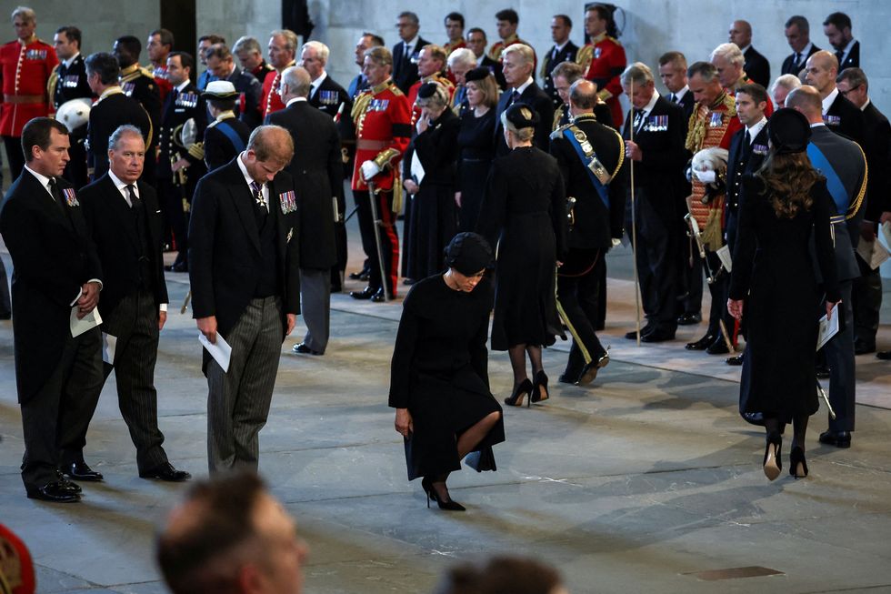 britains prince harry c l, duke of sussex, and meghan c, duchess of sussex, pay their respects inside westminster hall, at the palace of westminster, where the coffin of queen elizabeth ii, will lie in state on a catafalque, in london on september 14, 2022   queen elizabeth ii will lie in state in westminster hall inside the palace of westminster, from wednesday until a few hours before her funeral on monday, with huge queues expected to file past her coffin to pay their respects photo by alkis konstantinidis  pool  afp photo by alkis konstantinidispoolafp via getty images