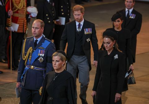 london, england   september 14 prince william, prince of wales, sophie, countess of wessex, catherine, princess of wales, prince harry, duke of sussex and meghan, duchess of sussex walk as procession with the coffin of britains queen elizabeth arrives at westminster hall from buckingham palace for her lying in state, on september 14, 2022 in london, united kingdom queen elizabeth iis coffin is taken in procession on a gun carriage of the kings troop royal horse artillery from buckingham palace to westminster hall where she will lay in state until the early morning of her funeral queen elizabeth ii died at balmoral castle in scotland on september 8, 2022, and is succeeded by her eldest son, king charles iii photo by phil noble   wpa poolgetty images
