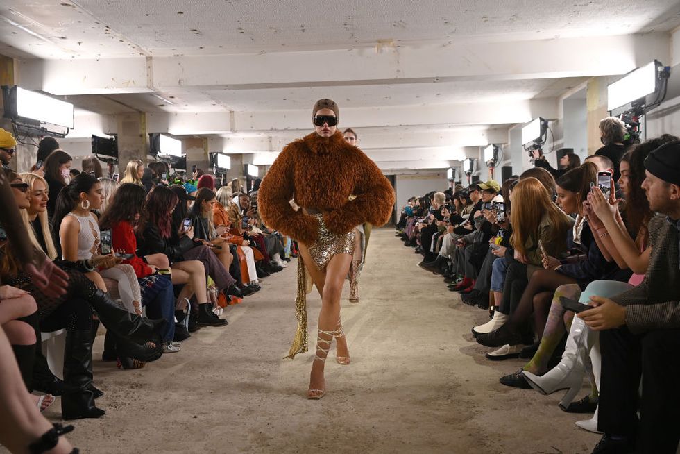 london, england   february 18 a model walks the runway at the poster girl show during london fashion week february 2022 on february 18, 2022 in london, england photo by kate greenbfcgetty images for bfc