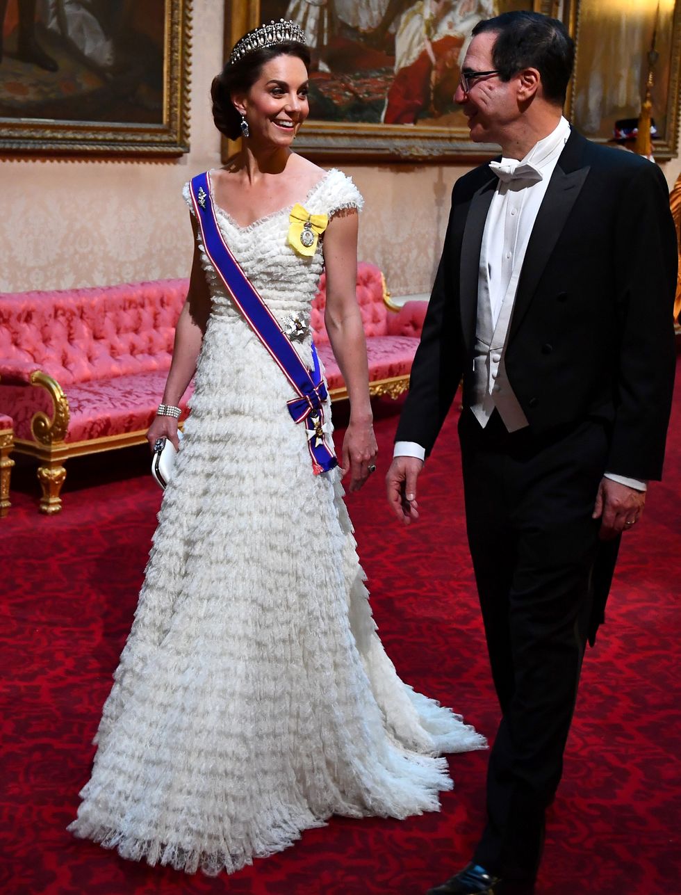 britains catherine, duchess of cambridge l walks with us secretary of treasury steven mnuchin as they arrive through the east gallery during a state banquet in the ballroom at buckingham palace in central london on june 3, 2019, on the first day of the us president and first ladys three day state visit to the uk   britain rolled out the red carpet for us president donald trump on june 3 as he arrived in britain for a state visit already overshadowed by his outspoken remarks on brexit photo by victoria jones  pool  afp        photo credit should read victoria jonesafp via getty images