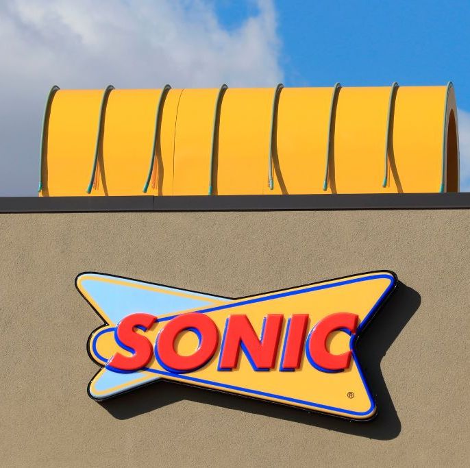 close up of sonic restaurant drive in logo on store front