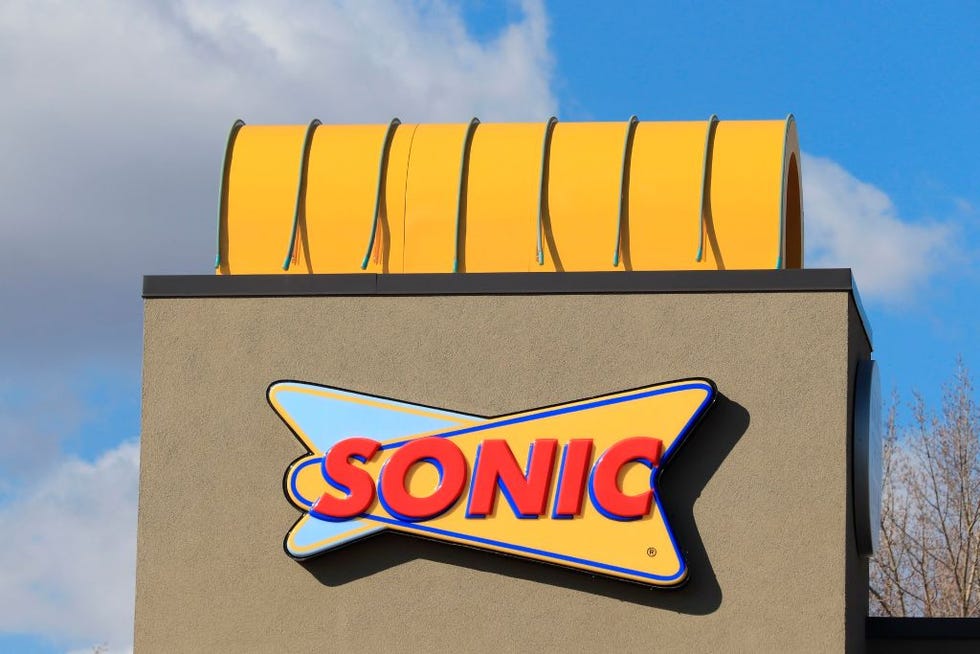 close up of sonic restaurant drive in logo on store front