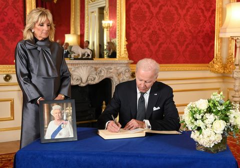 london, england   september 18 us president joe biden, accompanied by the first lady jill biden signs a book of condolence at lancaster house in london, following the death of queen elizabeth ii on september 18, 2022 in london, england foreign dignitaries, heads of state and other vips have visited westminster hall to view queen elizabeth ii lying in state prior to her funeral on monday they have also been invited to sign the book of condolence opened at lancaster house the 96 year old monarch died at balmoral castle in scotland on september 8, 2022, and is succeeded by her eldest son, king charles iii  photo by jonathan hordle wpa poolgetty images