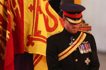 britains prince harry r, duke of sussex, mount a vigil around the coffin of queen elizabeth ii, draped in the royal standard with the imperial state crown and the sovereigns orb and sceptre, lying in state on the catafalque in westminster hall, at the palace of westminster in london on september 16, 2022, ahead of her funeral on monday   queen elizabeth ii will lie in state in westminster hall inside the palace of westminster, until 0530 gmt on september 19, a few hours before her funeral, with huge queues expected to file past her coffin to pay their respects photo by ian vogler  pool  afp photo by ian voglerpoolafp via getty images