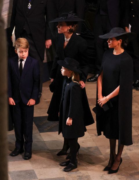 britains catherine 2l, princess of wales, meghan r, duchess of sussex, prince george l and princess charlotte attend the state funeral and burial of britains queen elizabeth, at westminster abbey in london, britain, september 19, 2022 photo by phil noble  pool  afp photo by phil noblepoolafp via getty images